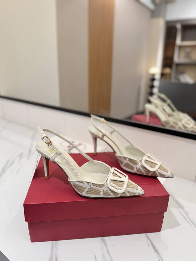 Valentino's Latest Valentino Garavani Signature Back-Tie High Heels, Adorned Wit
