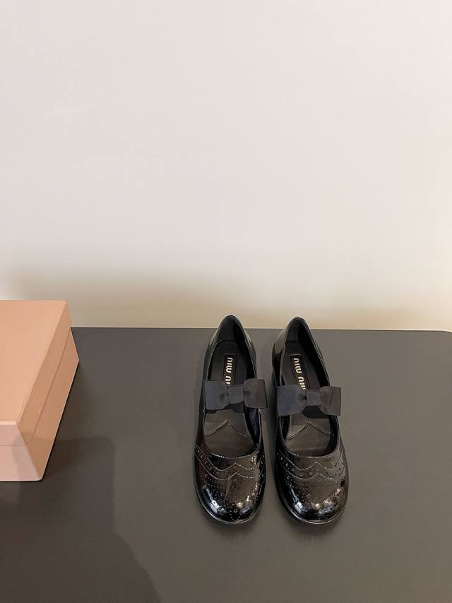 Miu Miu's Latest Mary Jane Bow-Tie Block Heel Loafers. The Adorable Details On T