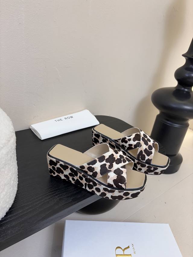The Row Thick-Soled Cross-Strap Slippers At First Glance, These Shoes Appear Sim