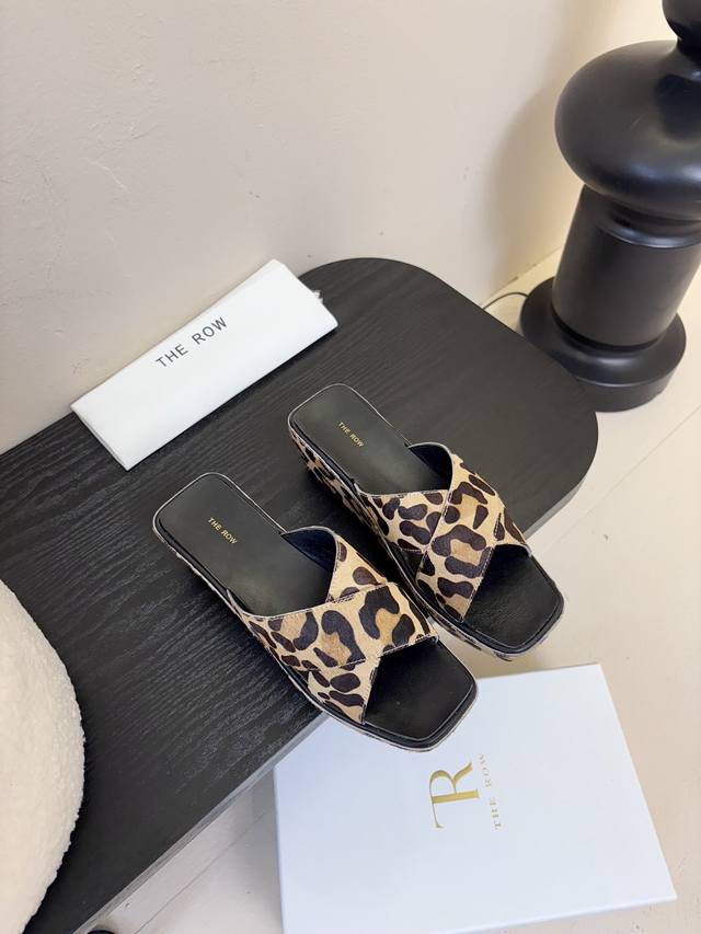 The Row Thick-Soled Cross-Strap Slippers At First Glance, These Shoes Appear Sim