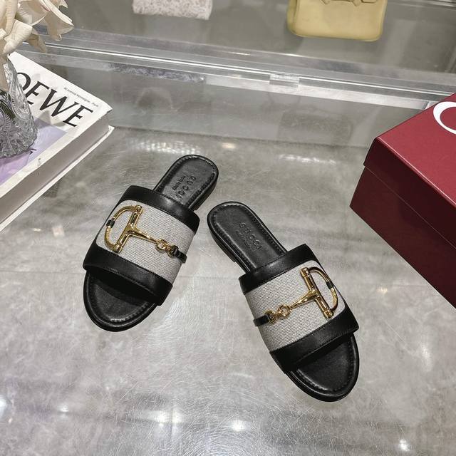 8023-1 Black Cloth 35-43 These Women's Slides Are Enhanced With Gold-Tone Hardwa