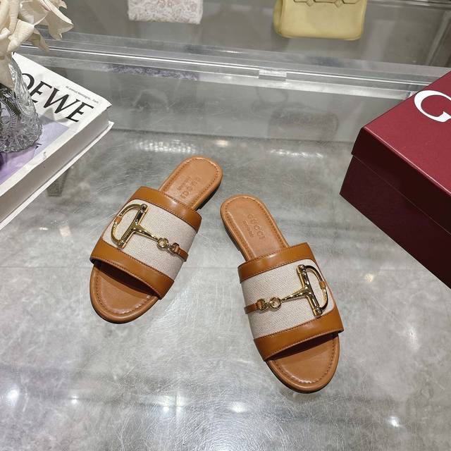 8023-1 Brown 35-43 These Women's Slides Are Enhanced With Gold-Tone Hardware And