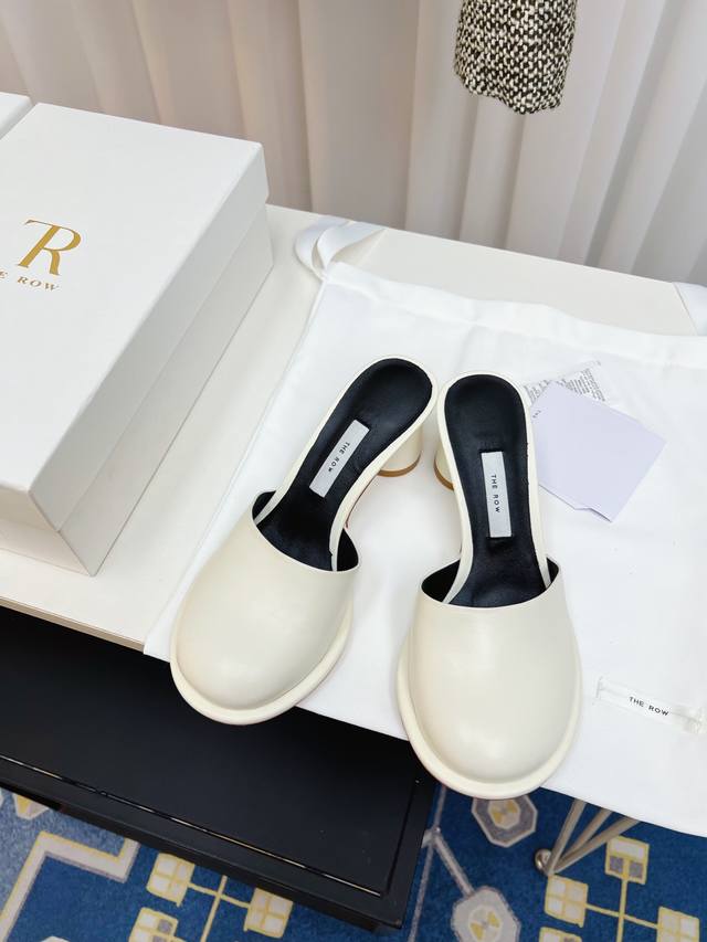 The Row French-Inspired Minimalist Round-Toe Slip-On Sandals. Retro-Chic Queen.