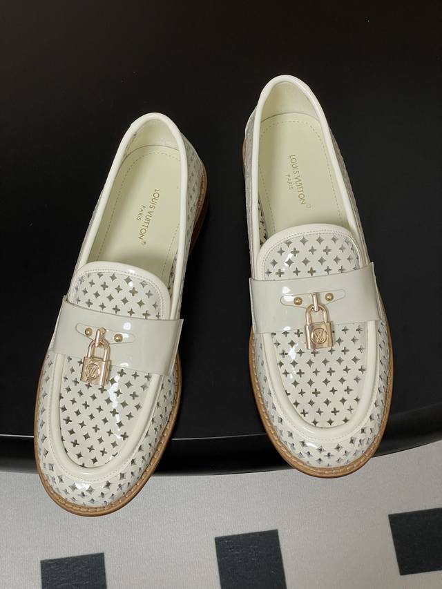 New Monogram Floral Perforated Loafers With A Lock Buckle. The Monogram Floral P