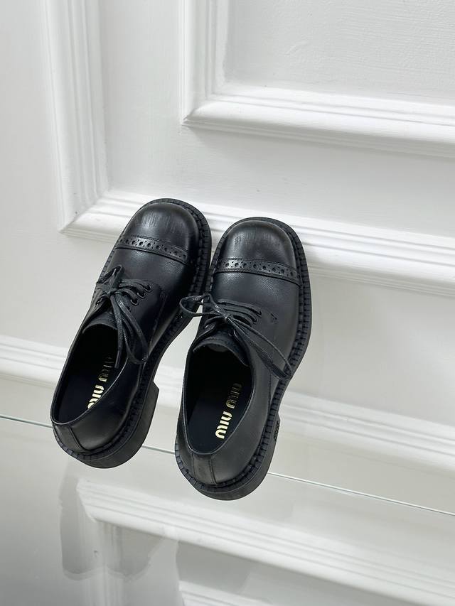 Miu Miu British-Inspired Minimalist Motorcycle-Style Leather Loafers. The Shangh