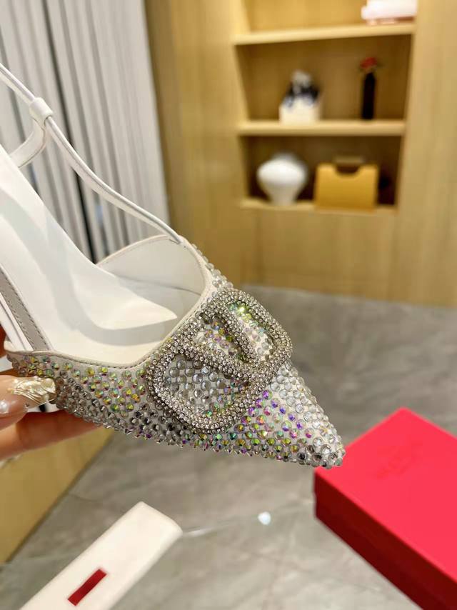 Valentino. Valentino's Iconic Large V-Shaped Buckle Single-Sole Shoe From The La