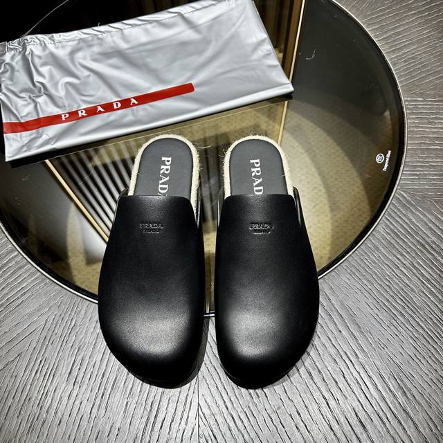 prada This Stylish And Casual Mule Cleverly Combines Refined Texture With The