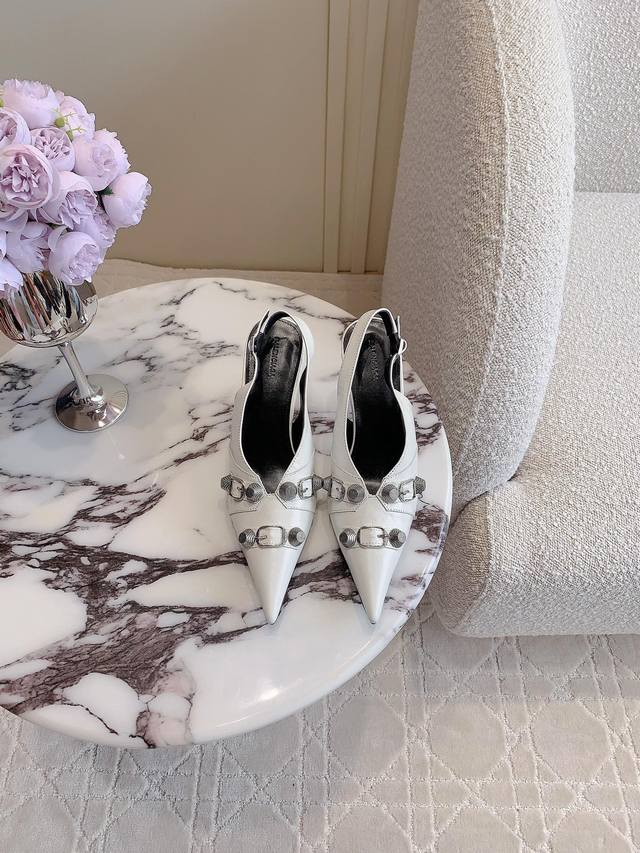 Miu Miu half-slip sneakers are a perfect fusion of sport and elegance. The light