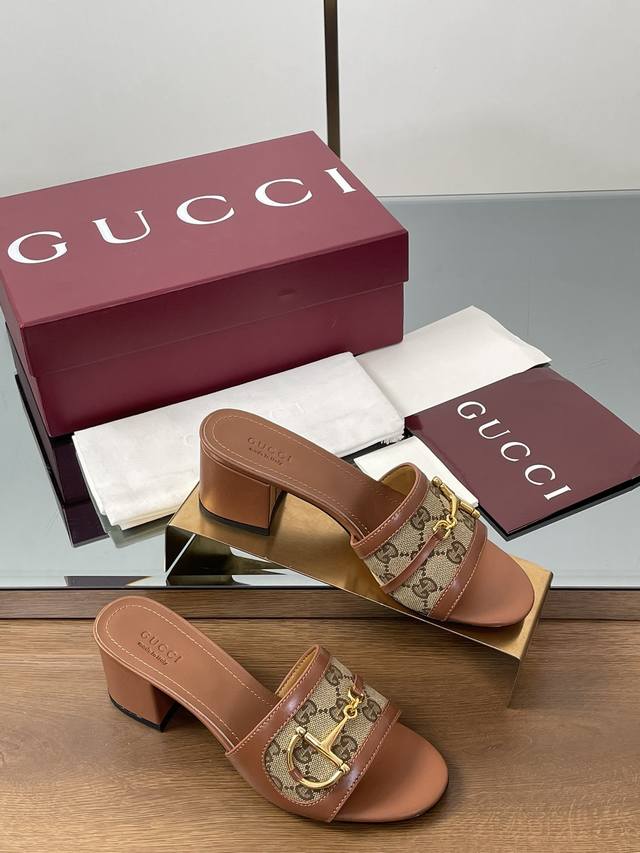 Unisex Gg Slippers Gucci's signature shoe for women features an eye-catching the