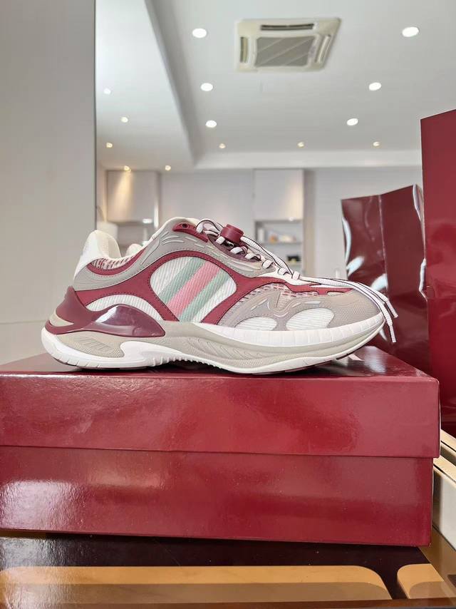 Gucci 2.0 sneakers reinterpret the brand's iconic striped ribbon elements. When