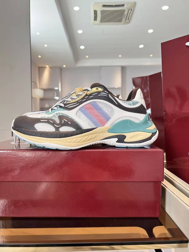 Gucci 2.0 sneakers reinterpret the brand's iconic striped ribbon elements. When