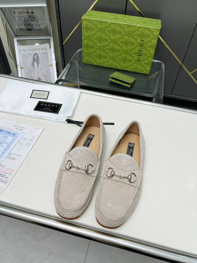 Gucci men's loafers, with the iconic classic horsebit design on the shoe, have a