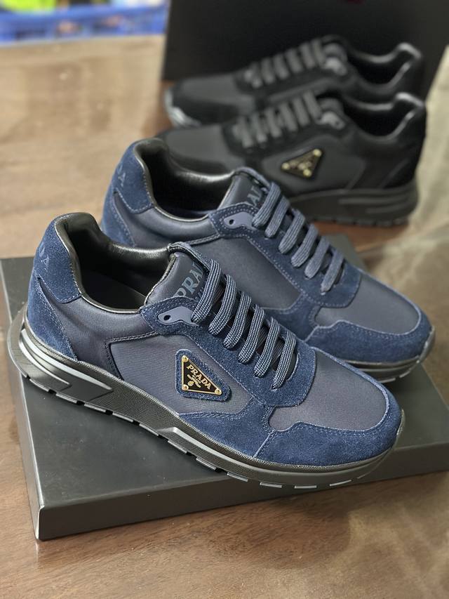 2Ee436 This sneaker features a Re-Nylon and suede upper in a sporty, fusion silh