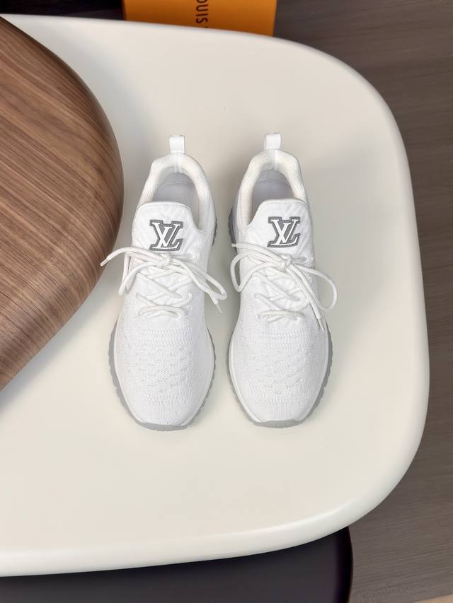 L This Beverly Hills sneaker uses textured Monogram flying woven fabric and the