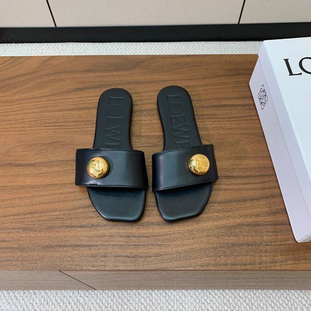 Loew* gold-buckle leather slippers. Simple and elegant, full of texture. Very ni