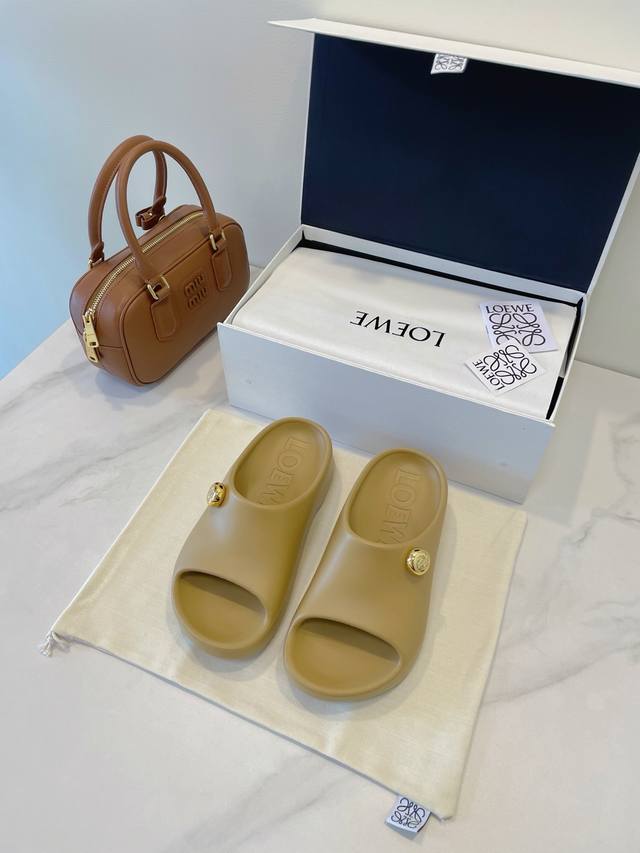 Loewe Foam Pebble Sandals Lightweight foam rubber sandals with shiny metal Anagr
