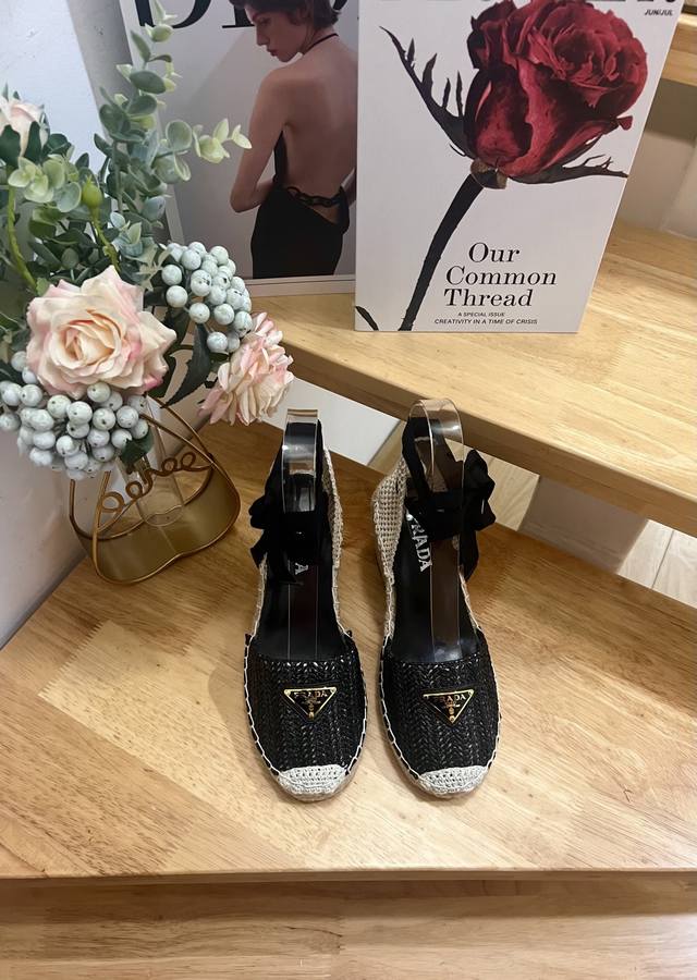 Prada Early Spring 2025, this wedge-heeled espadrille comes with a espadrille in