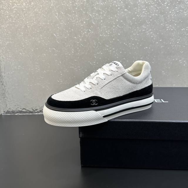 Chanel 2025B thick-soled black and white panda shoes - a pair of platform white