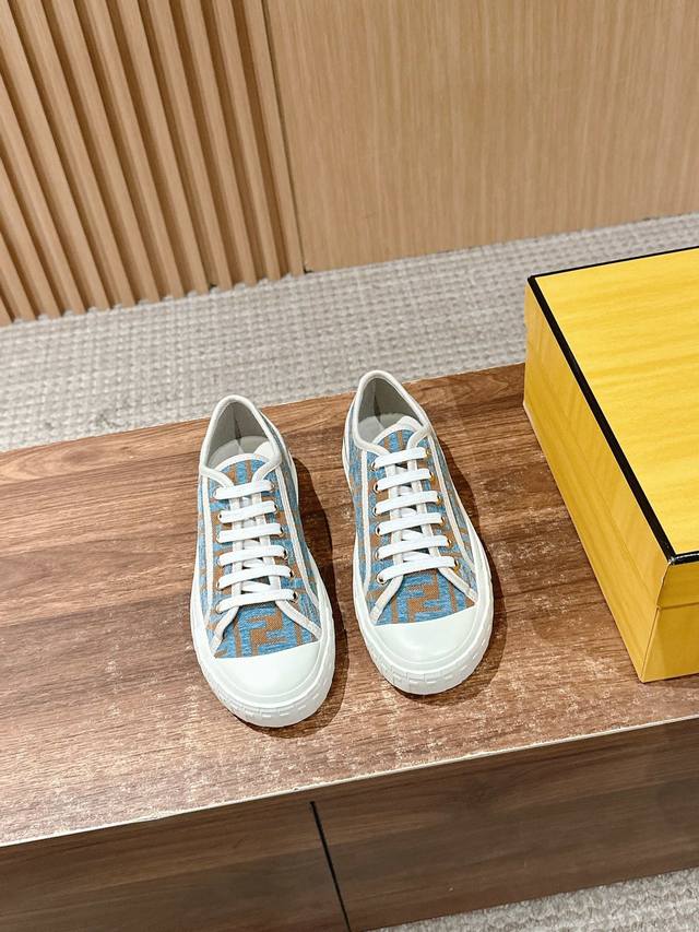 Fendi new canvas casual sneakers with rubber sole. Made of cloth with stitched F