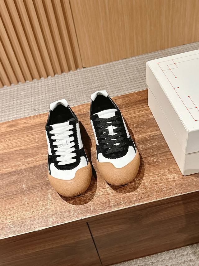 The Alexander Wang McQueen Flexion sneaker combines retro styling with a modern