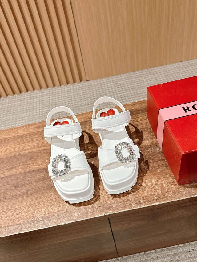 Roger Vivier's new leather wedge sandals. Made of nappa leather, the upper is em