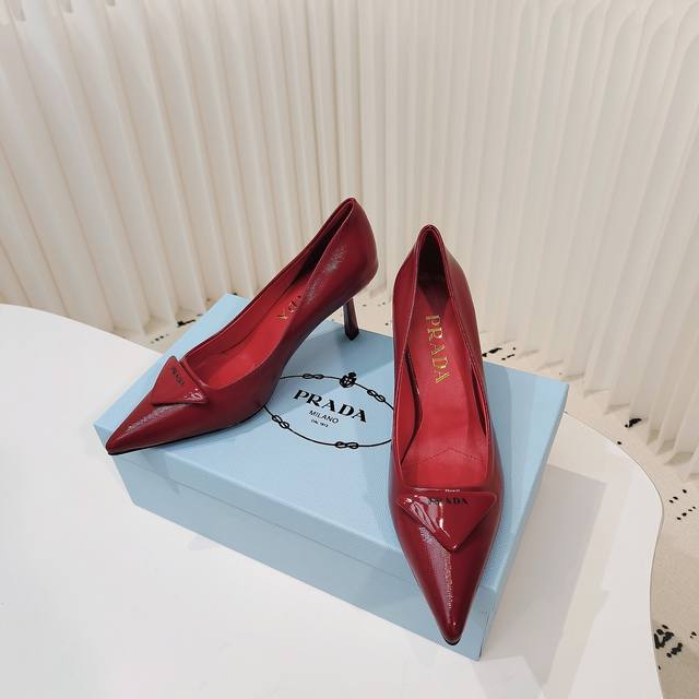 Prada shiny leather pointed toe pumps These pumps are crafted from shiny leather