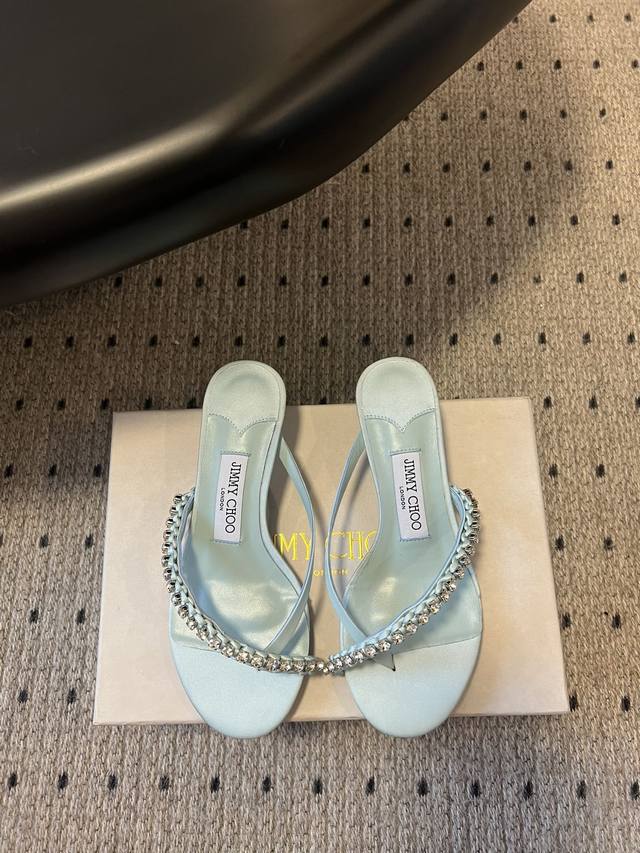 Jimmycho*'s new flat-soled diamond-striped slippers are one of the brand's class