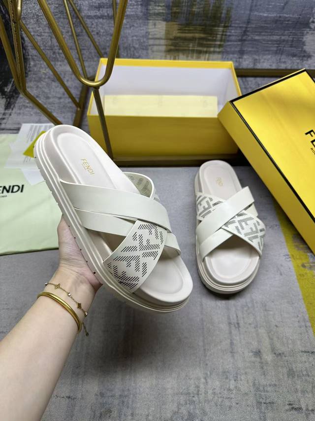 Fendi's latest cross-stripe slippers, off-white leather with laser engraved Ff p