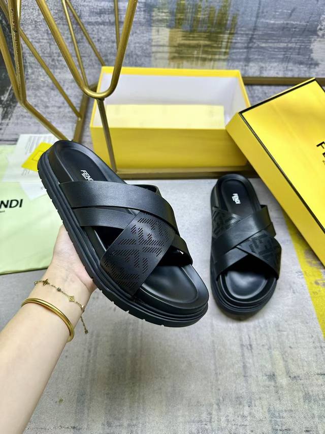 Fendi's latest cross-stripe slippers, black leather with laser engraved Ff patte