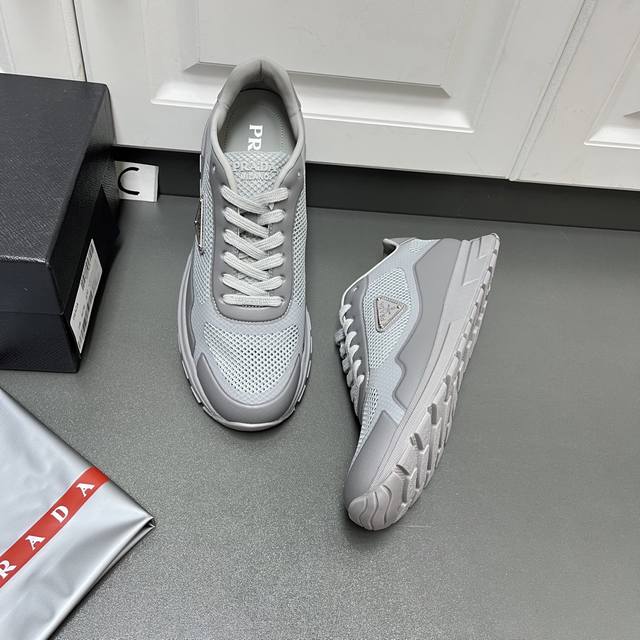 Prada Men's New Fabric Mesh Lace-up Sneakers This model uses a lightweight matte