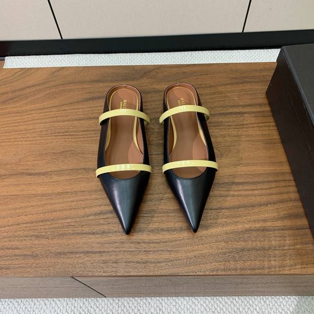 Malone Souliers flat-soled half-slippers. I like to achieve a balanced feeling b