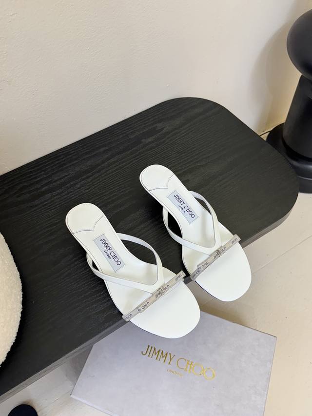 Jimmycho* The new flat-soled diamond-striped slippers are one of the brand's cla