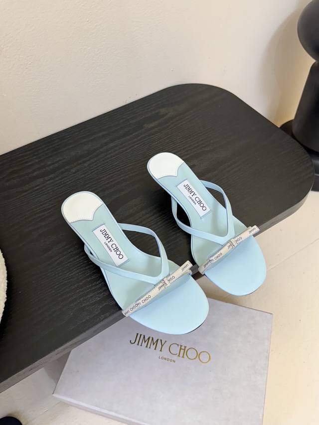 Jimmycho* The new flat-soled diamond-striped slippers are one of the brand's cla