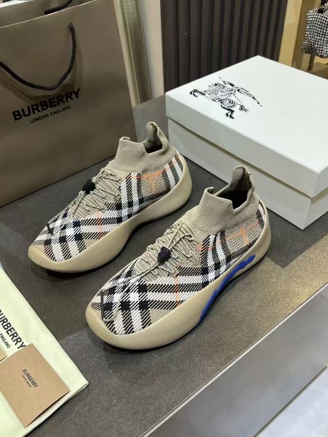 Made in Italy sneaker with breathable Burberry check knit sock upper. Leather l