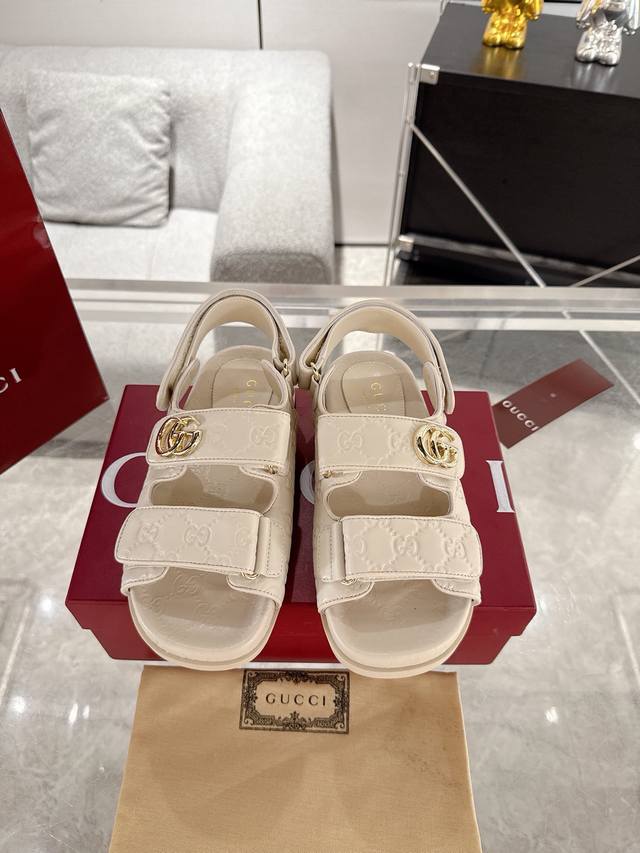 Factory Price: Women's Original Gucci GG Embossed Sandals. Crafted from GG leath