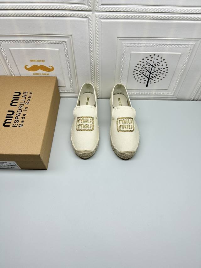 New Arrival. Miu Miu flat-heeled fisherman shoes. Crafted from cotton canvas and