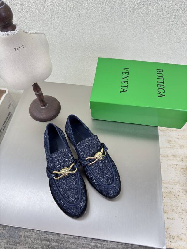 Blue washed denim with distressed metal hardware buckle. Bottega Venet* women's