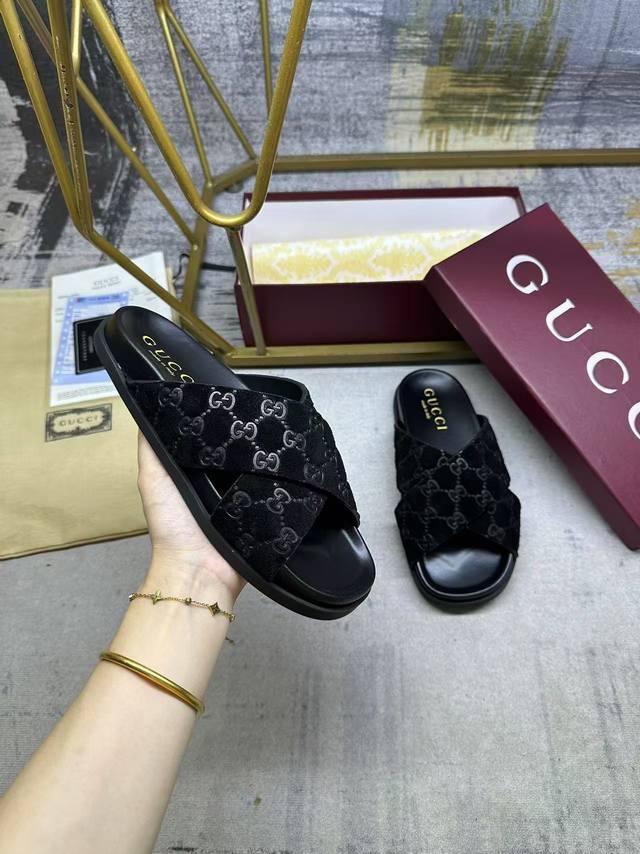 Gucci's latest hit slippers, featuring a soft suede upper with a Gg pattern for