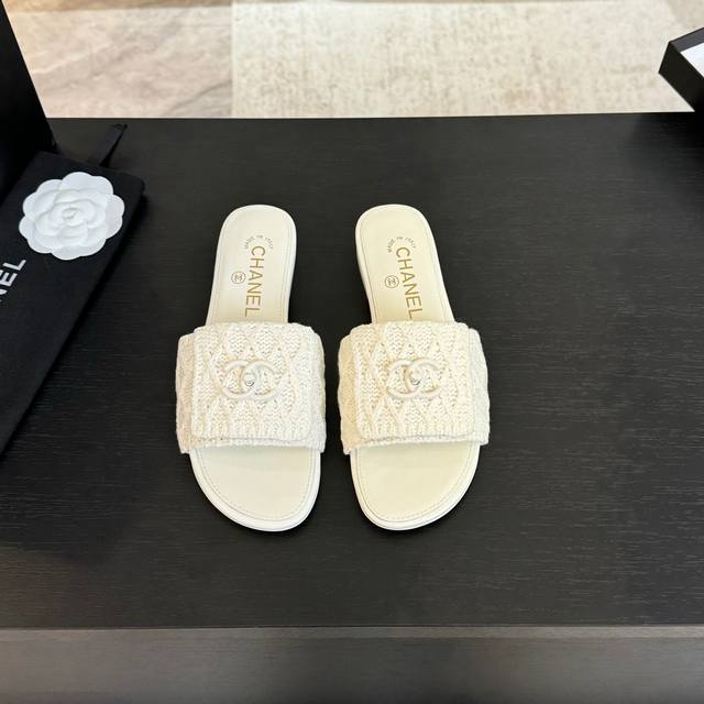 Chane* | Chanel's classic flip-top slippers with satin buckle are timeless. The