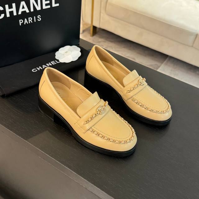New Spring/Summer Chanel Leather Chain Loafers. The upper features classic eleme