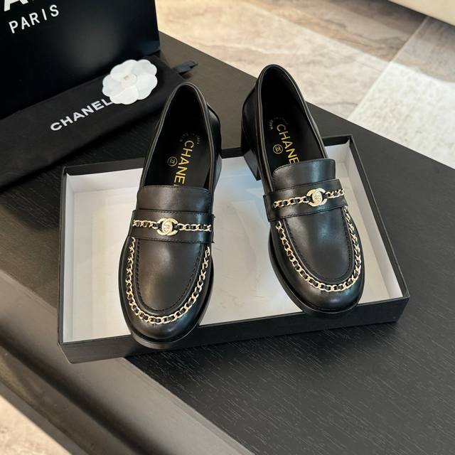 New Spring/Summer Chanel Leather Chain Loafers. The upper features classic eleme