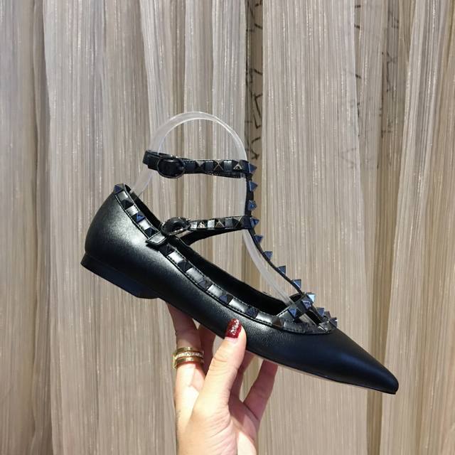 Five Valentino designs in matte black lambskin available year-round. Valentino i