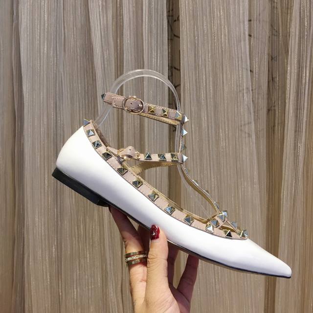 Five white patent leather collections available year-round. Valentino is a globa