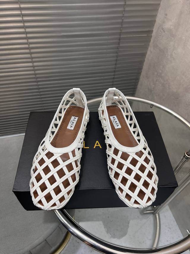 Alaia catwalk-style ballet flats with hollowed-out soles and a Roman-style desig