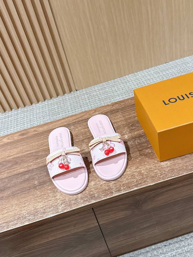 slip-on sandals are from Louis Vuitton x Takashi Murakami Retro Collection. Made