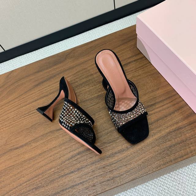 Amina Muaddi diamond-faced slippers. The mesh surface is embellished with rhines