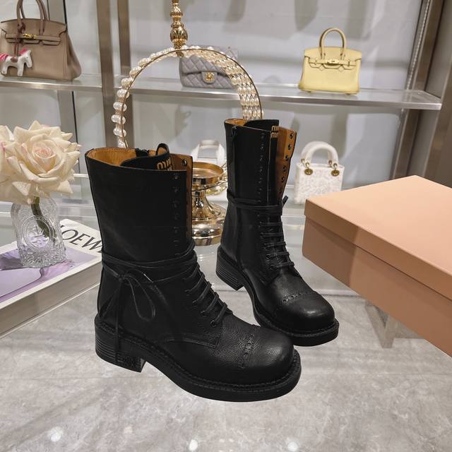 These new fall/winter Martin boots are incredibly stylish, showcasing Miu Miu's