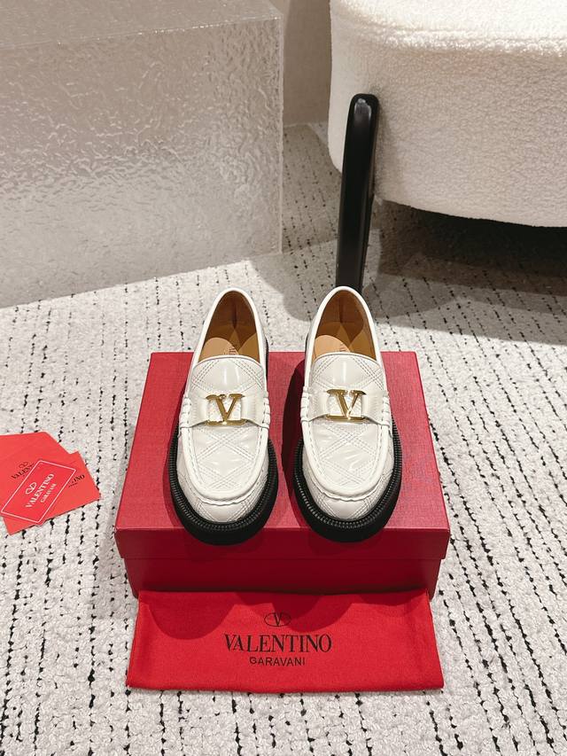 Valentino. Valentino's latest V-neck shoes with fire-rivet metal accents. Luxuri