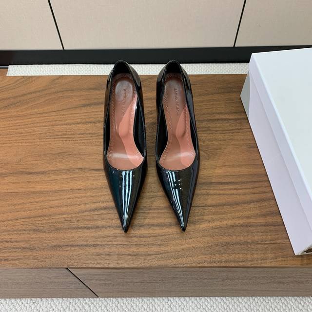 Amina Muaddi pointed-toe shoes. A simple, elegant style. Patent leather and shee
