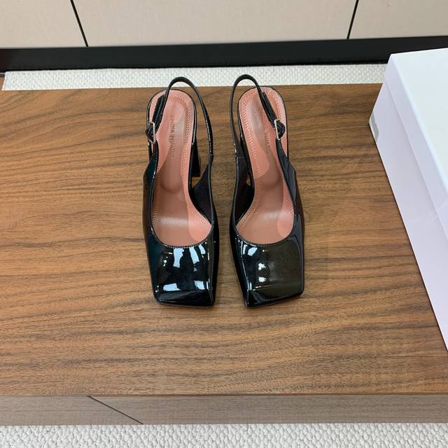 Amina Muaddi slingback block heel shoes. A simple, elegant style. Patent leather